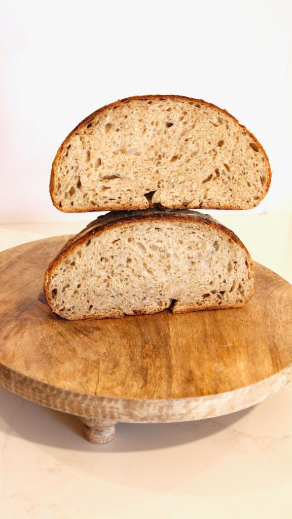 Stacked slices of sourdough bread, portrait view